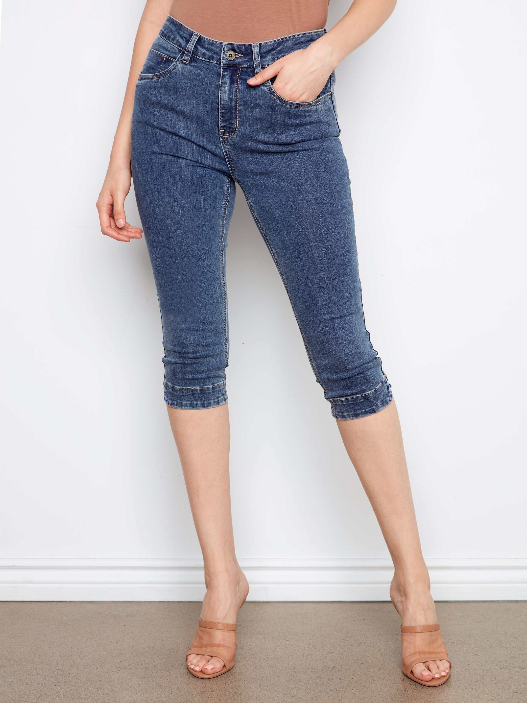 Charlie B 19” Cropped Denim Capris in medium blue wash, styled with tan open-toe sandals by Charlie B