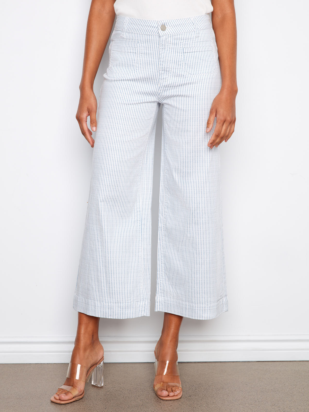 Charlie B Double Trouble Lines Flare Jean in light blue striped denim by Charlie B, styled with clear block heels