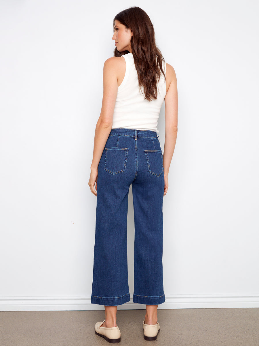 Back view of Charlie B Double Trouble High Rise Flared Denim Jeans in dark blue denim by Charlie B.