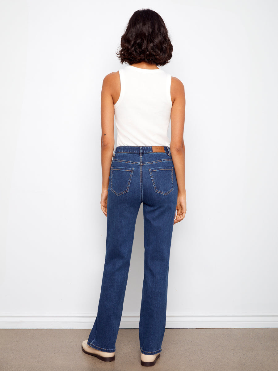 Charlie B Charlotte Straight Leg Denim Jeans in indigo blue shown from the back with a white sleeveless top