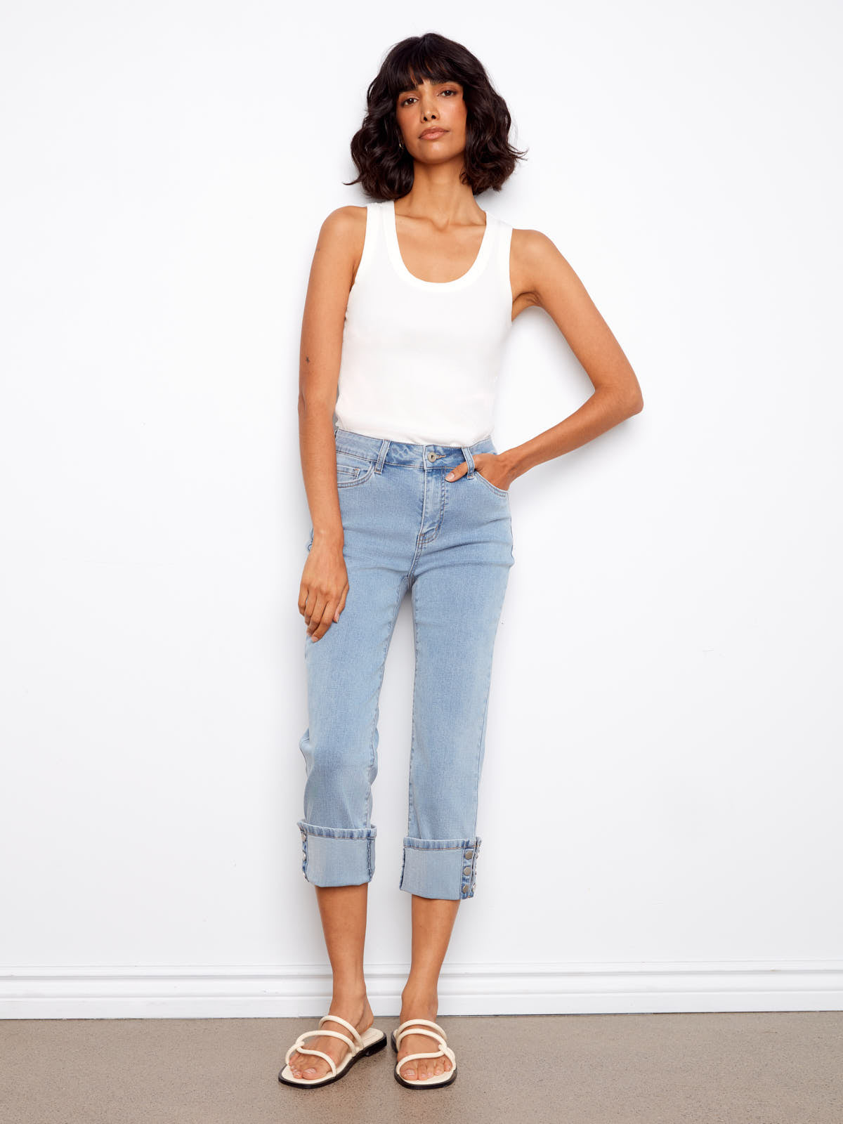 Light wash denim with snap button cuffs featuring the Charlie B Up Down Snap 26” Cropped Denim Capris by Charlie B