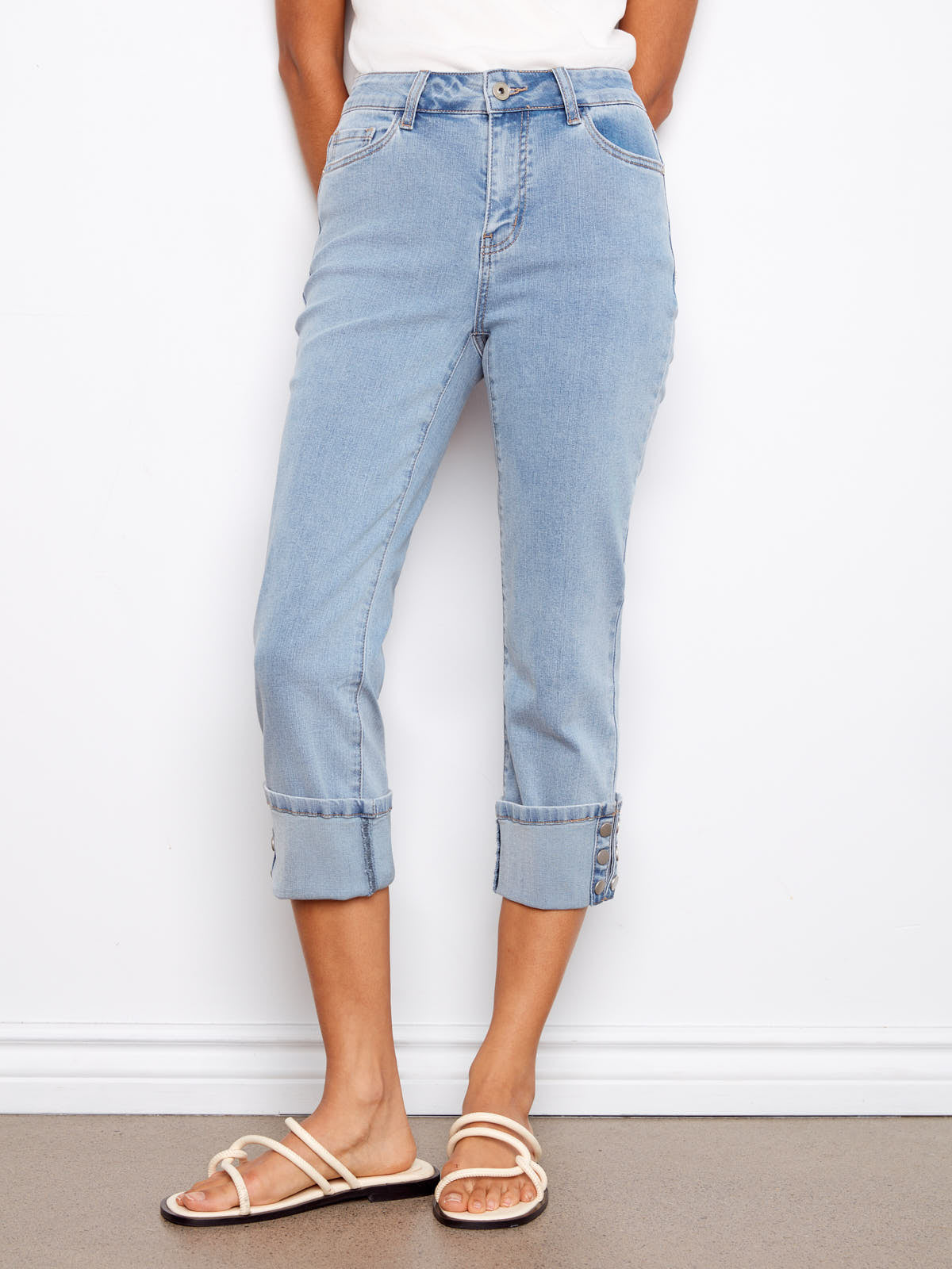 Light wash denim Charlie B Up Down Snap 26” Cropped Denim Capris with rolled cuffs and button detailing by Charlie B.
