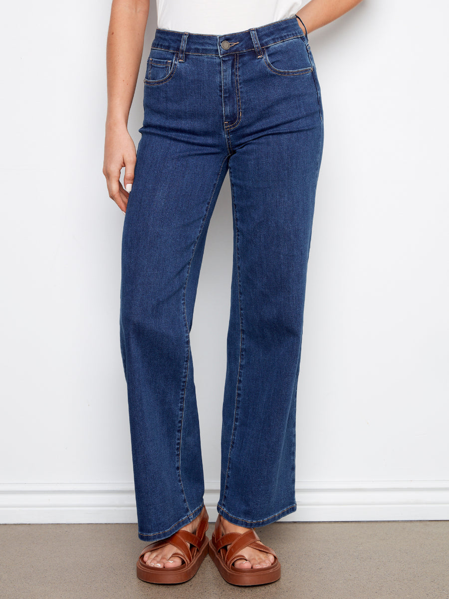 Charlie B Chloe Wide Leg Denim Jeans in dark blue denim styled with brown sandals by Charlie B.
