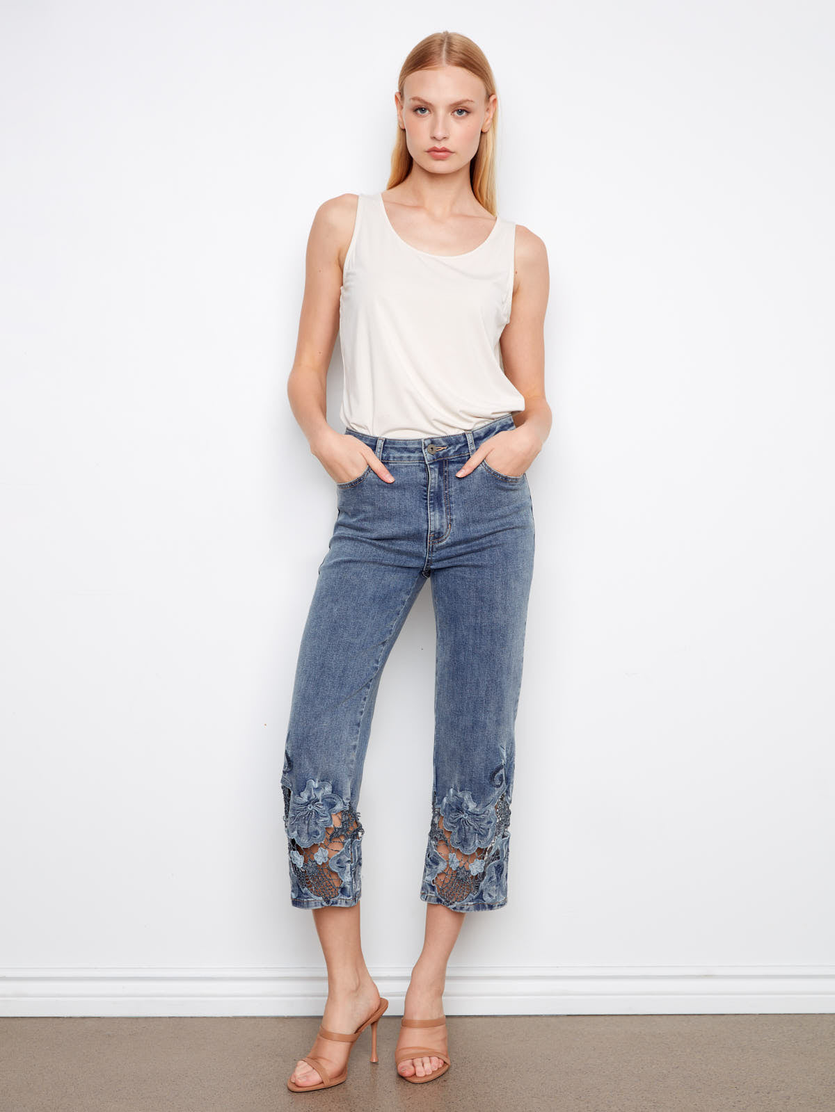 Charlie B Open Lace 25” Wide Denim Capris in medium wash denim with floral lace detail at hems by Charlie B.