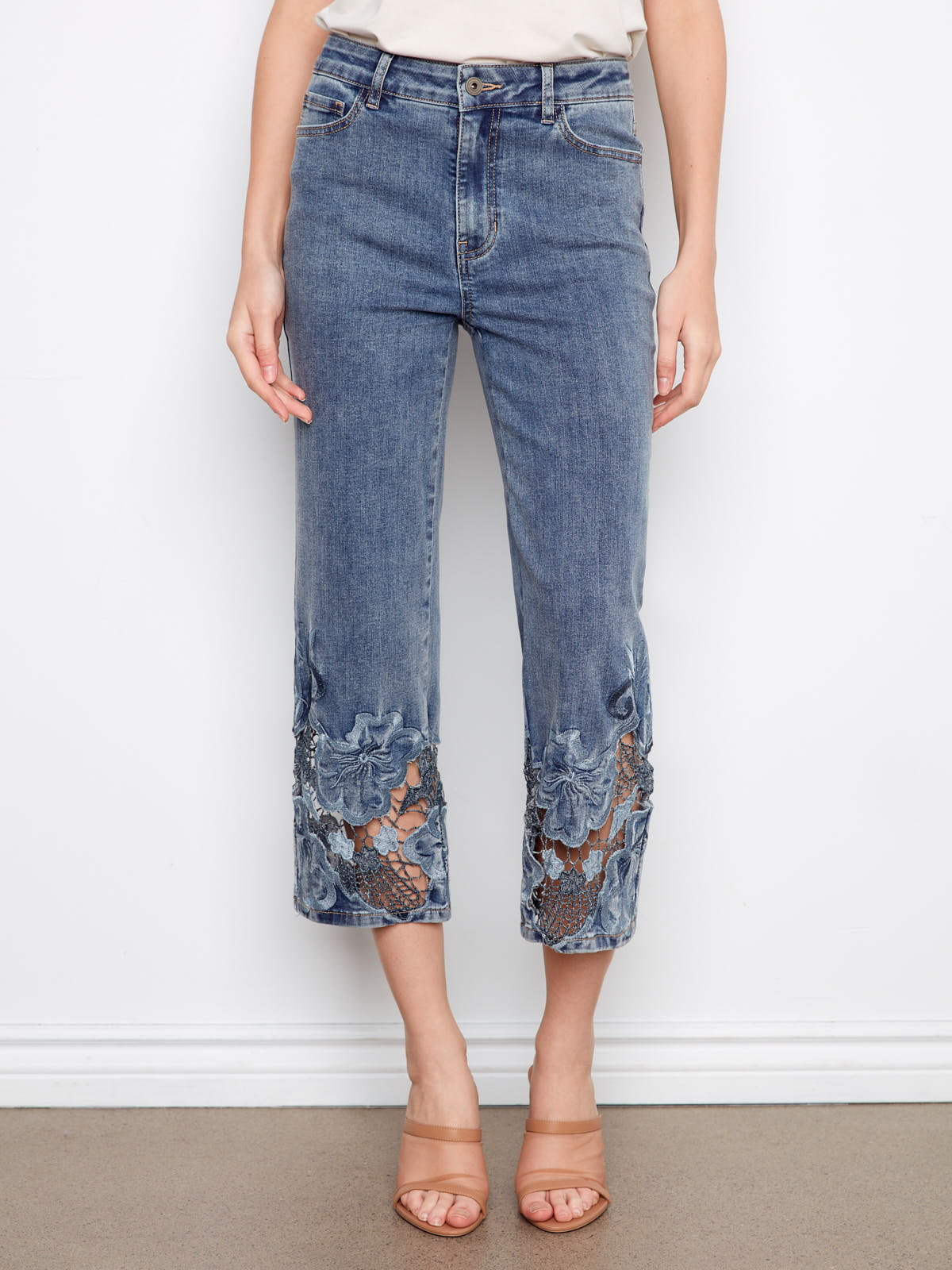 Charlie B Open Lace 25” Wide Denim Capris with floral lace detail at the hem in medium wash denim by Charlie B