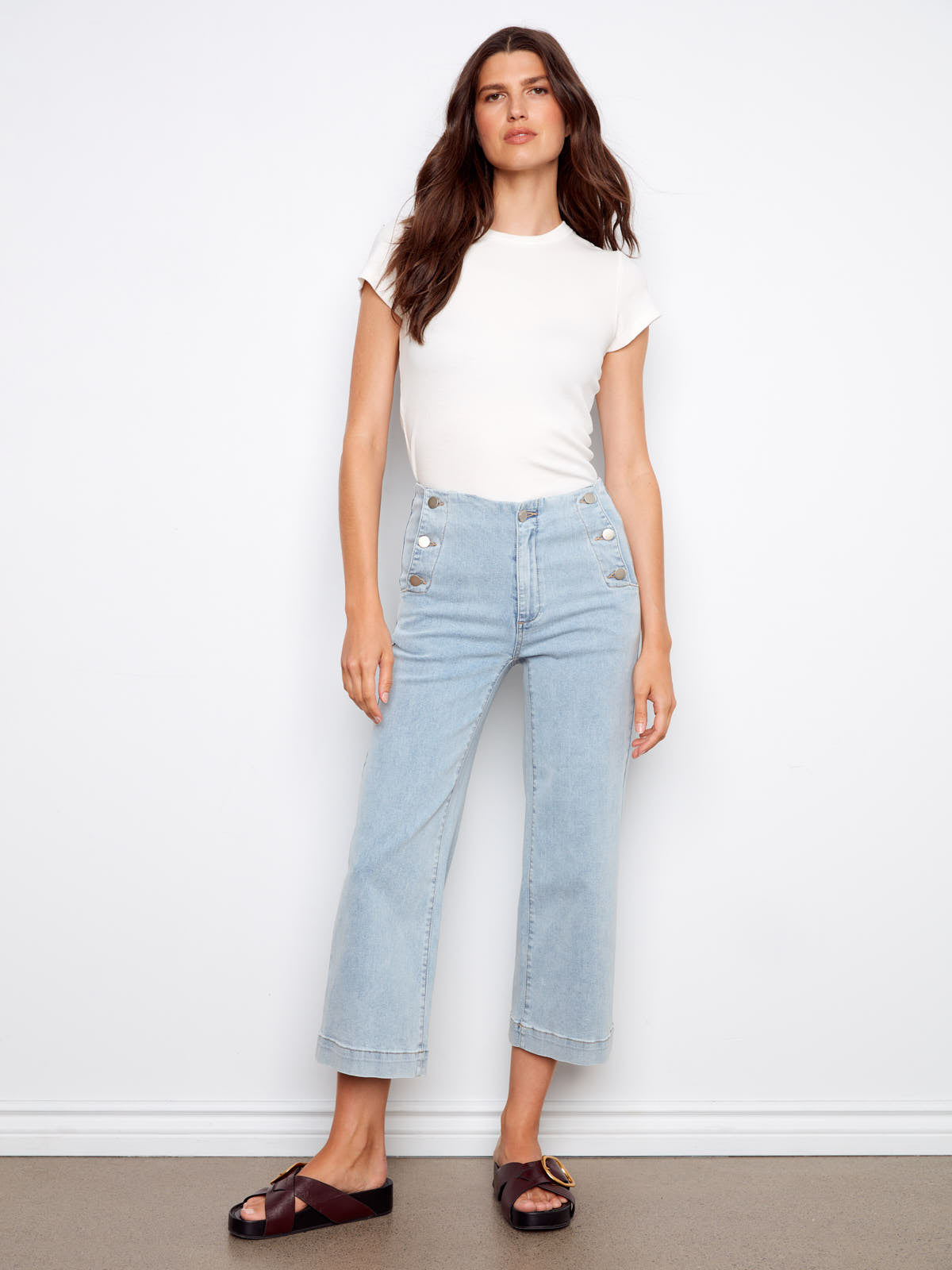 Light wash denim capris with button details styled with a white tee and sandals by Charlie B Triple Threat 26” Denim Capris