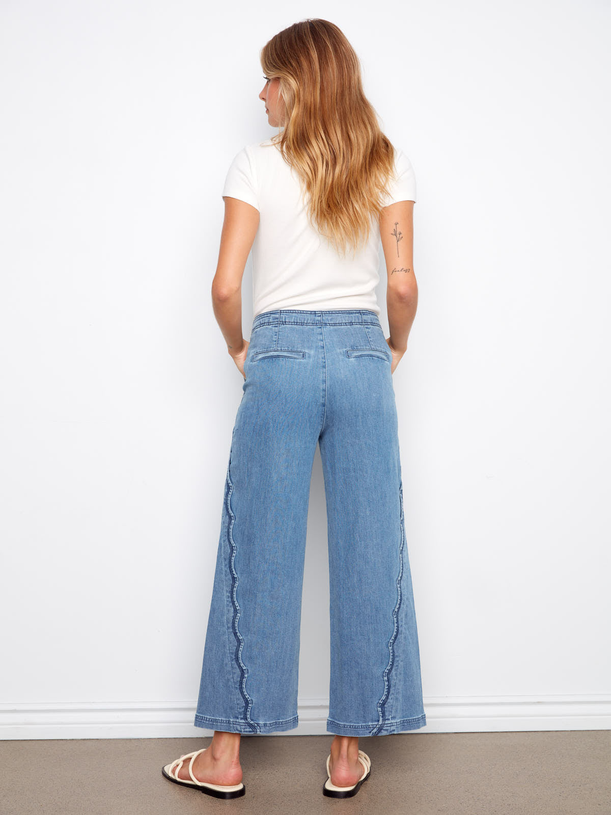 Charlie B Scallop Wave 27” Denim Pant in light blue denim with scalloped wave detailing down the sides by Charlie B