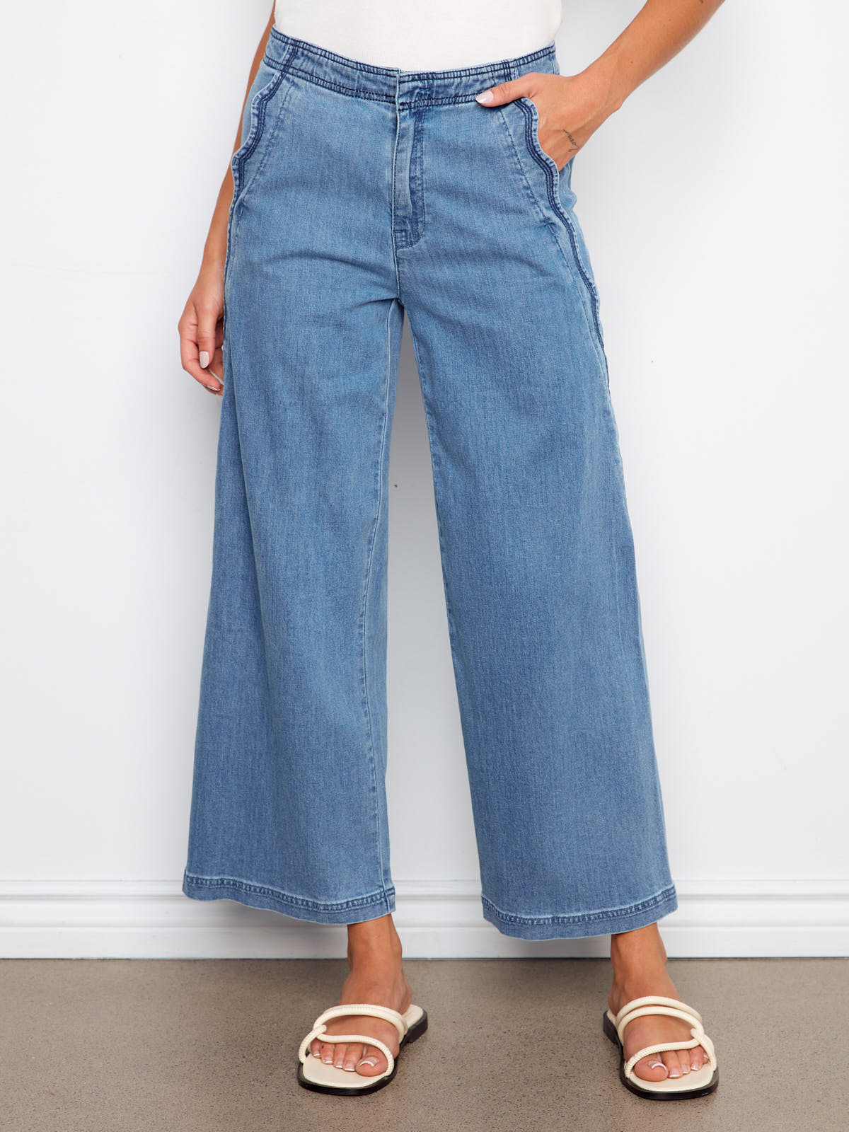 Charlie B Scallop Wave 27” Denim Pant in medium blue denim with wide legs and scalloped side seams by Charlie B.