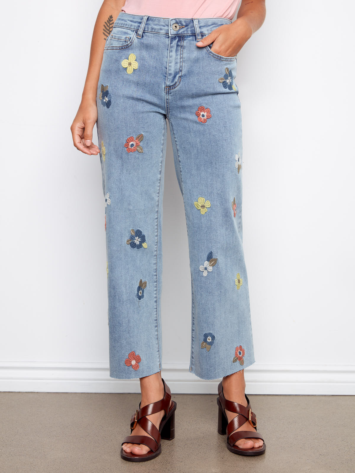 Charlie B Embroidered Flower 27” Wide Denim Jeans with colorful floral embroidery and light wash denim by Charlie B