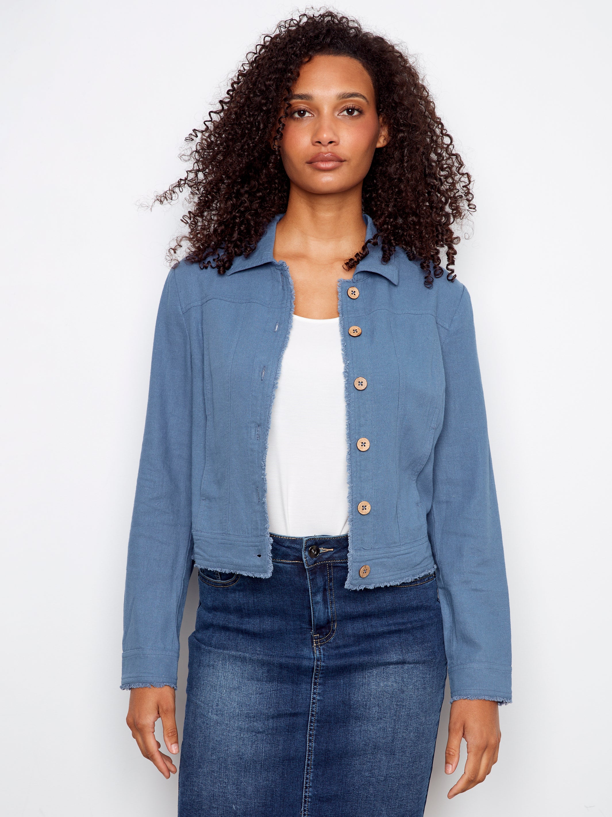 Charlie B Linen Jacket in soft blue with button front and frayed edges styled with white top and denim skirt