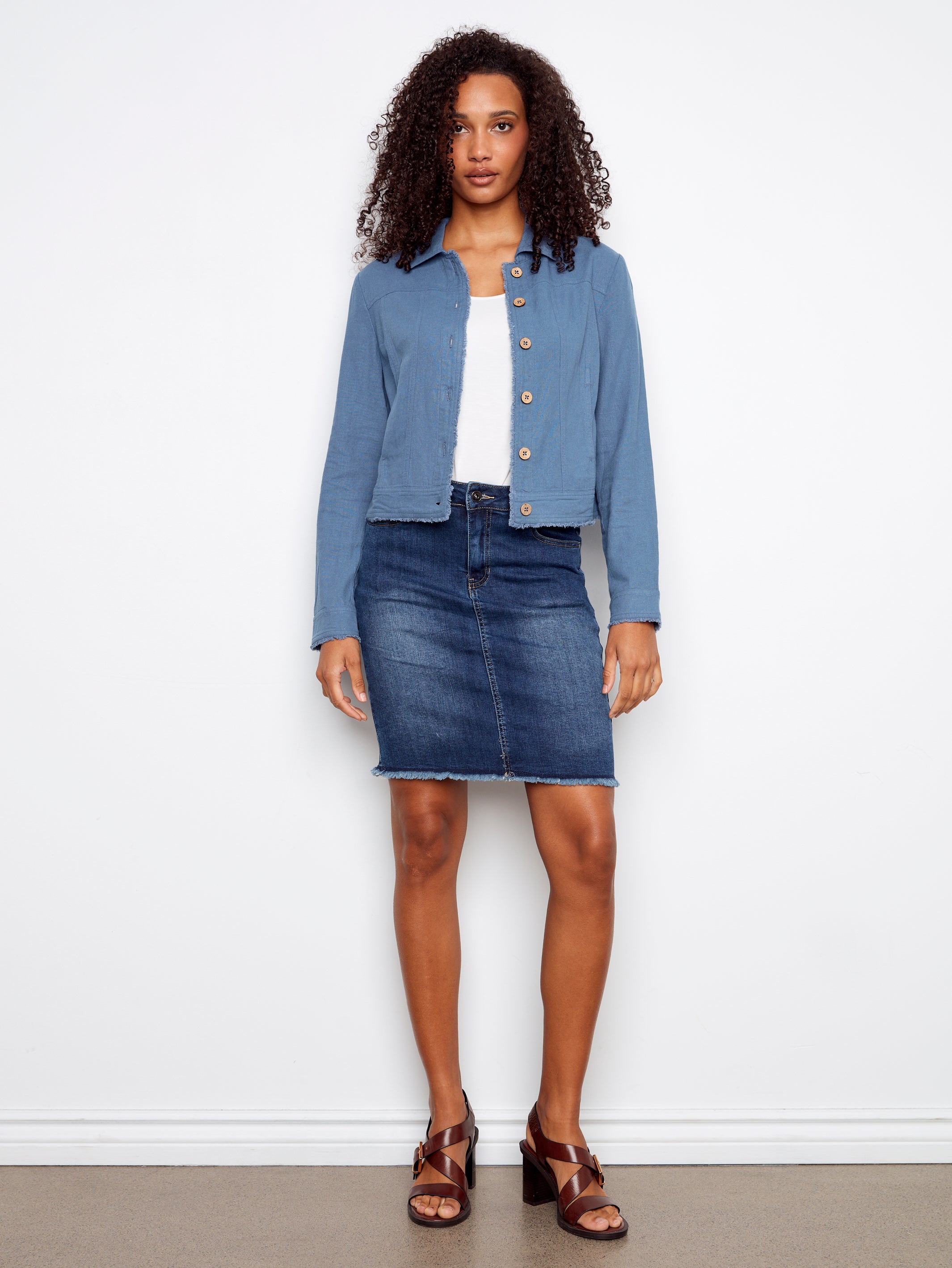 Charlie B Linen Jacket in muted denim blue with button front, paired with denim skirt and brown sandals by Charlie B