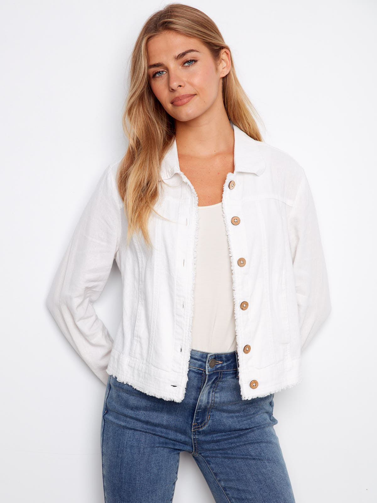 White Charlie B Linen Jacket with wooden buttons paired with blue jeans, styled by Charlie B.