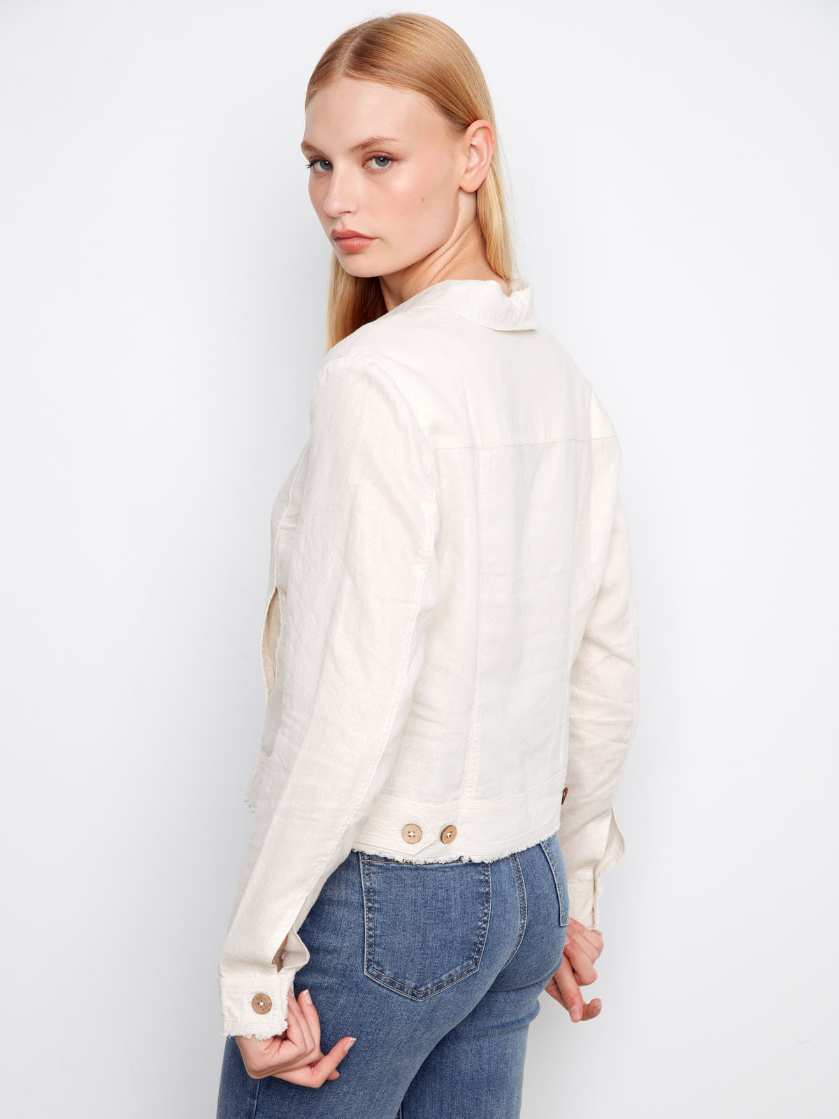 Back view of a light champagne Charlie B Foiled Linen Jacket paired with blue denim jeans by Charlie B.