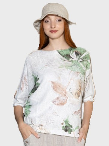 Lush Tropics 3/4 Sleeve Printed Top by Cherishh in white with green and beige tropical leaf patterns and textured fabric.