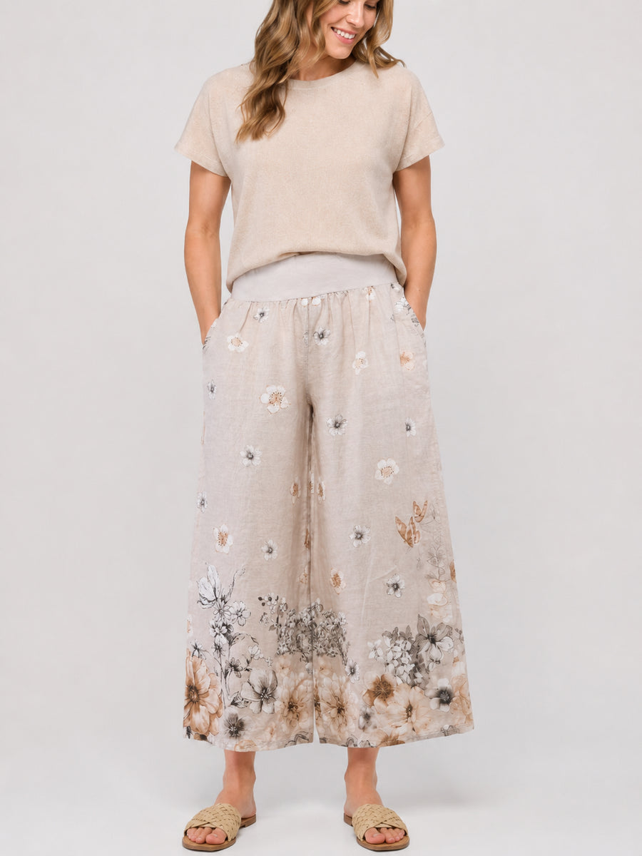 Painted Linen Print Palazzo Pants by Cherishh in beige with floral patterns and wide-leg linen fabric design.