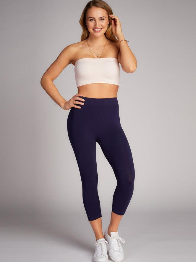 Navy 3/4 Seamless Bamboo Leggings from Coast To Coast Trading shown with casual white sneakers and simple jewelry.