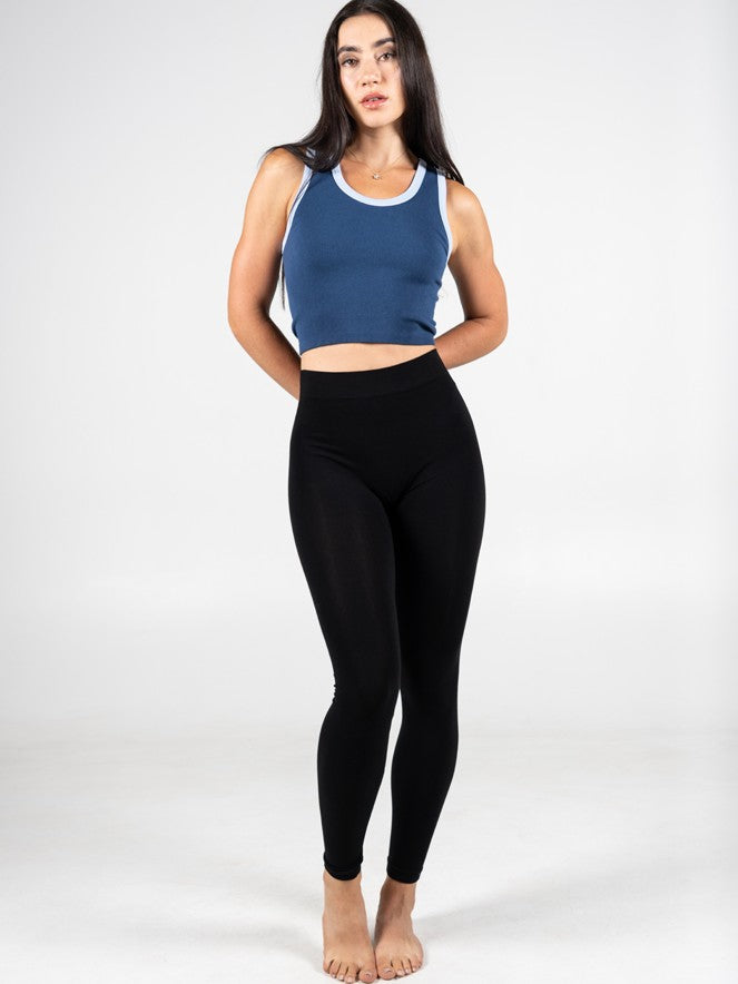 Full Length Bamboo Leggings by Coast To Coast Trading in black, styled with a blue crop top against a white background