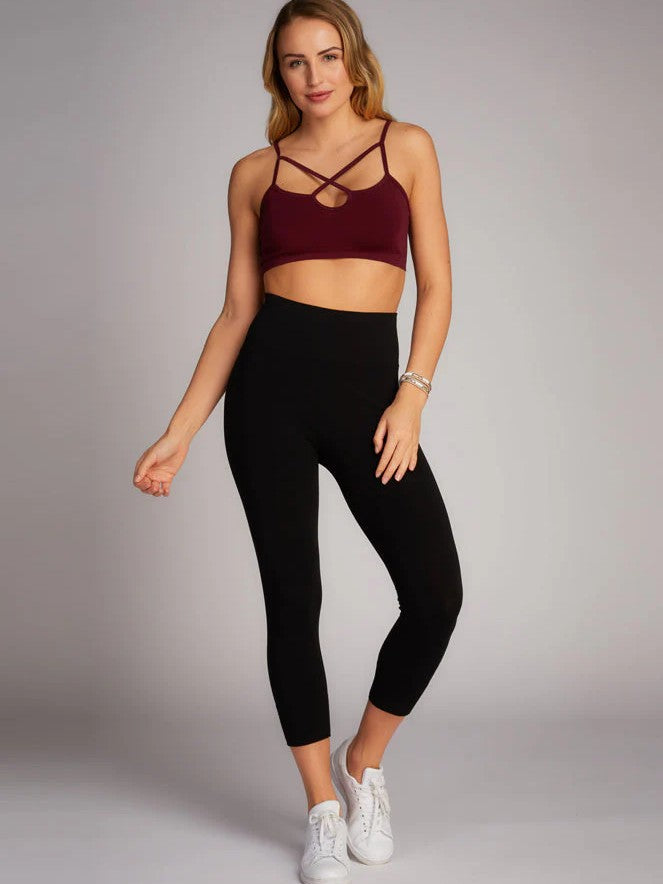 Black 3/4 High Waist Bamboo Leggings by Coast To Coast Trading paired with white sneakers and maroon crop top.