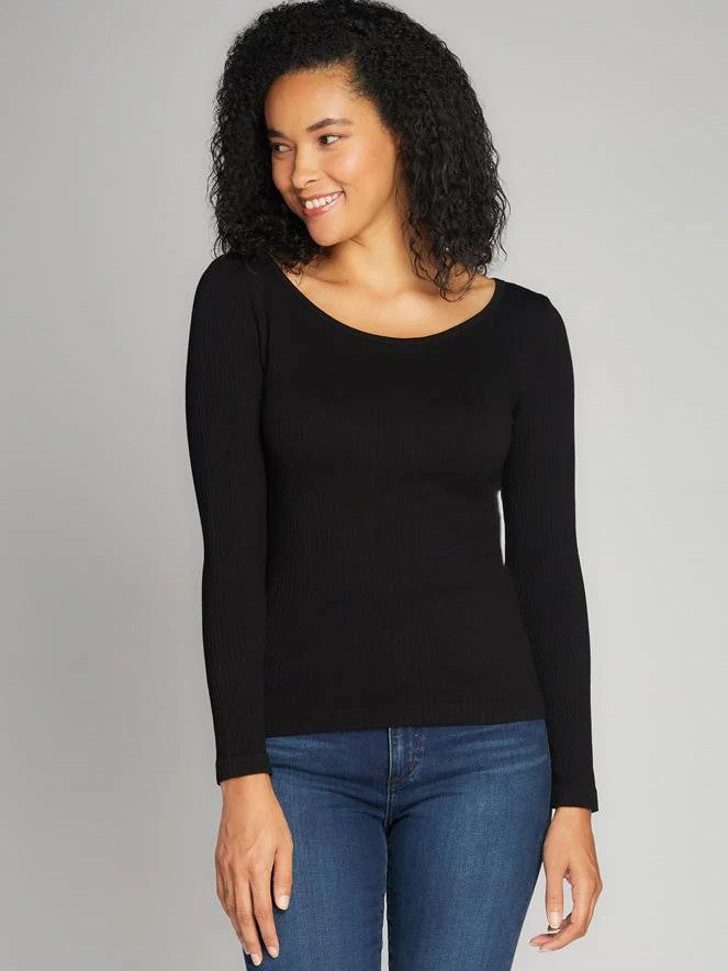 Seamless Rib Knit Long Sleeve Crew Neck Top in black by Coast To Coast Trading paired with blue denim jeans.