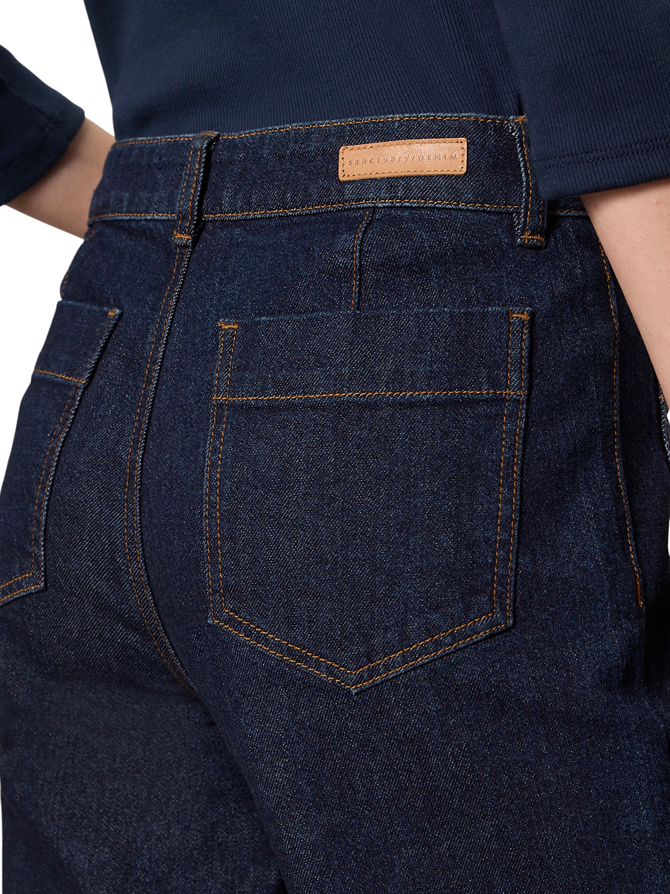 Close-up of dark denim fabric and dual pockets on Sanctuary Marine Double Pocket 27” Denim Pant by Sanctuary