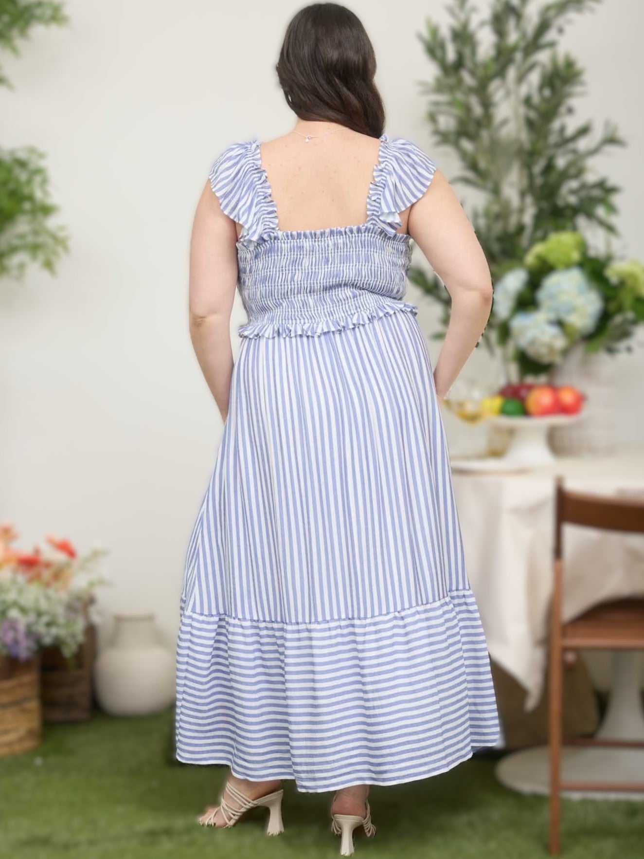 Blue and white vertical striped sleeveless dress with ruffled straps and tiered skirt detail
