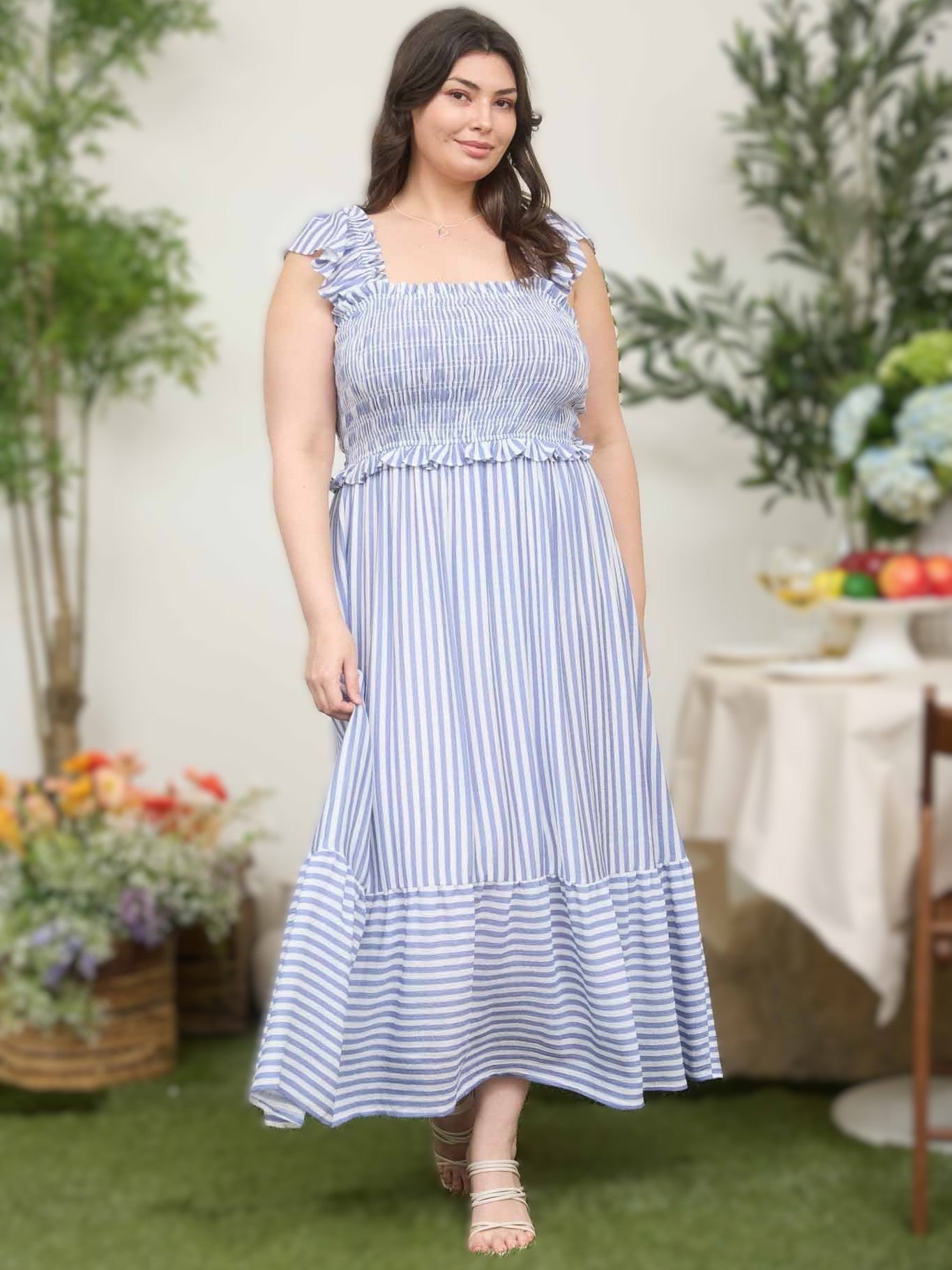 Smocked Stripe Ruffle Midi Dress in blue and white stripes by Mine with ruffle detailing and a flowy silhouette