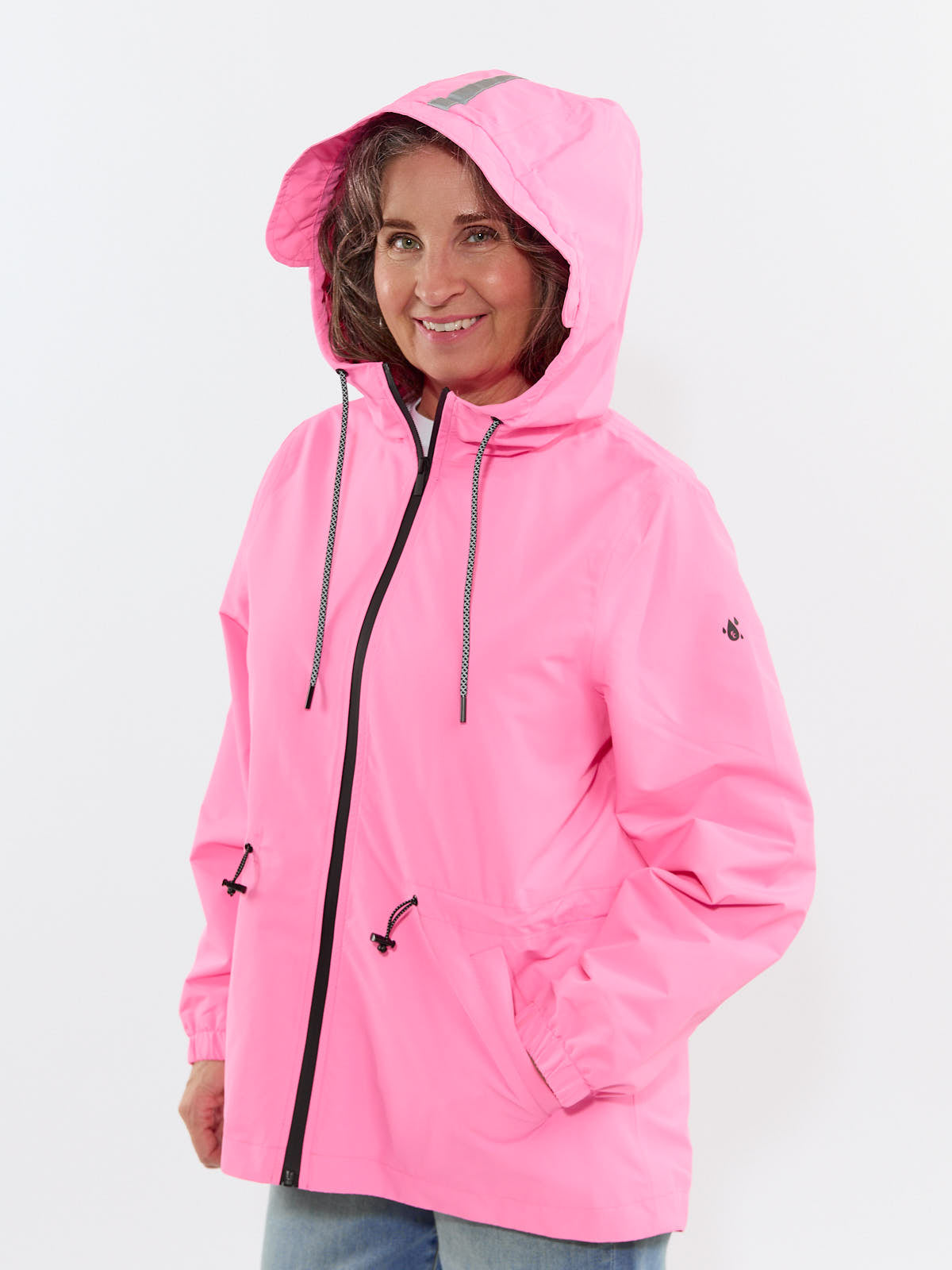 Smiling model in a pink Fashion Concepts Women’s Weather Ready 3/4 Length Waterproof Coat with hood and front pockets