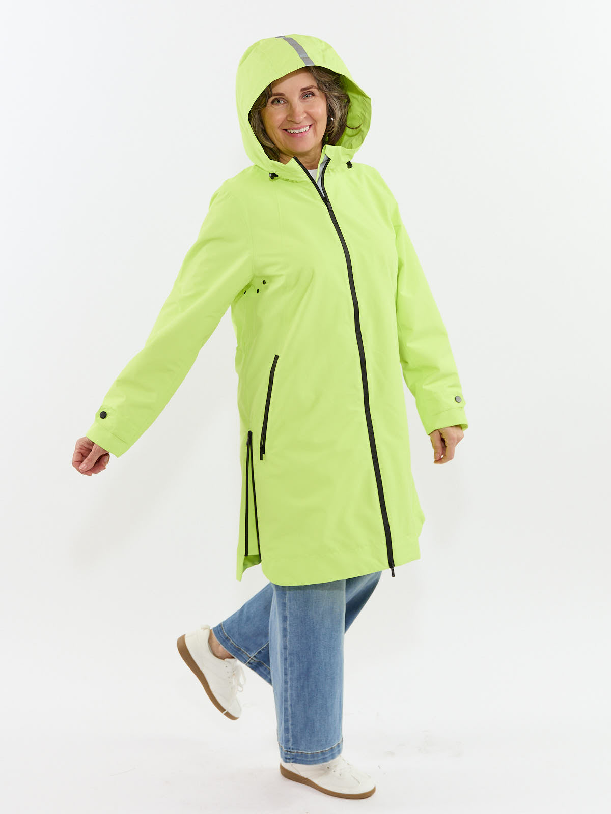 Bright green outerwear styled with casual denim and sneakers highlights the Fashion Concepts Weather Ready 3/4 Length Waterproof Coat.