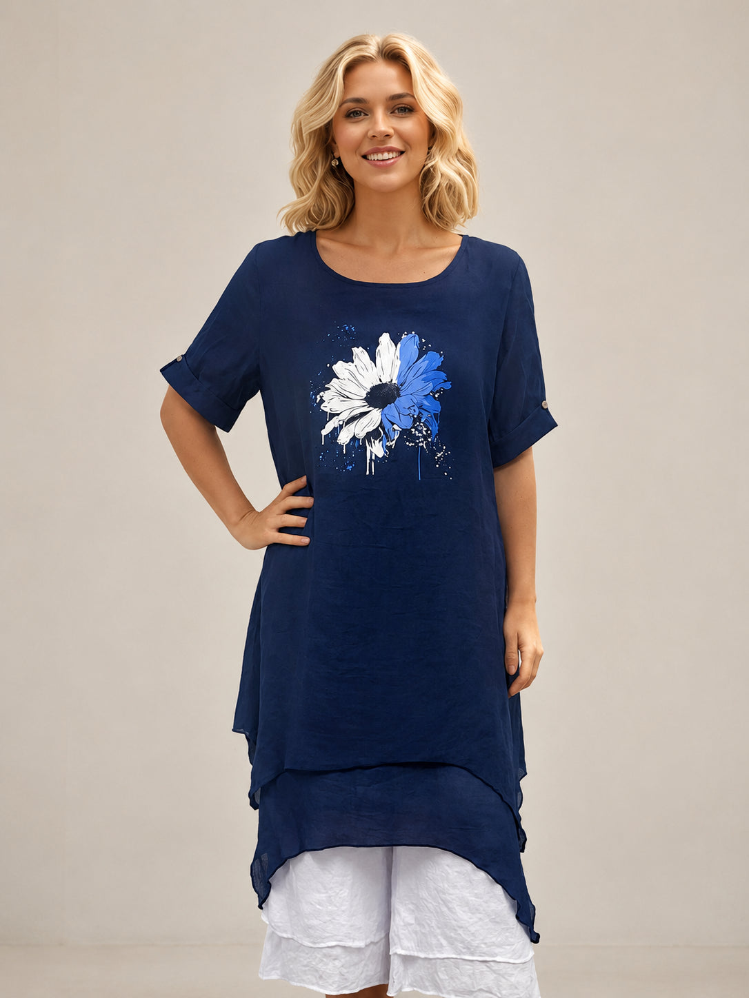 Creation Blue Daisy Layered Dress by Creations in navy blue with white and blue daisy print, layered hem detail.