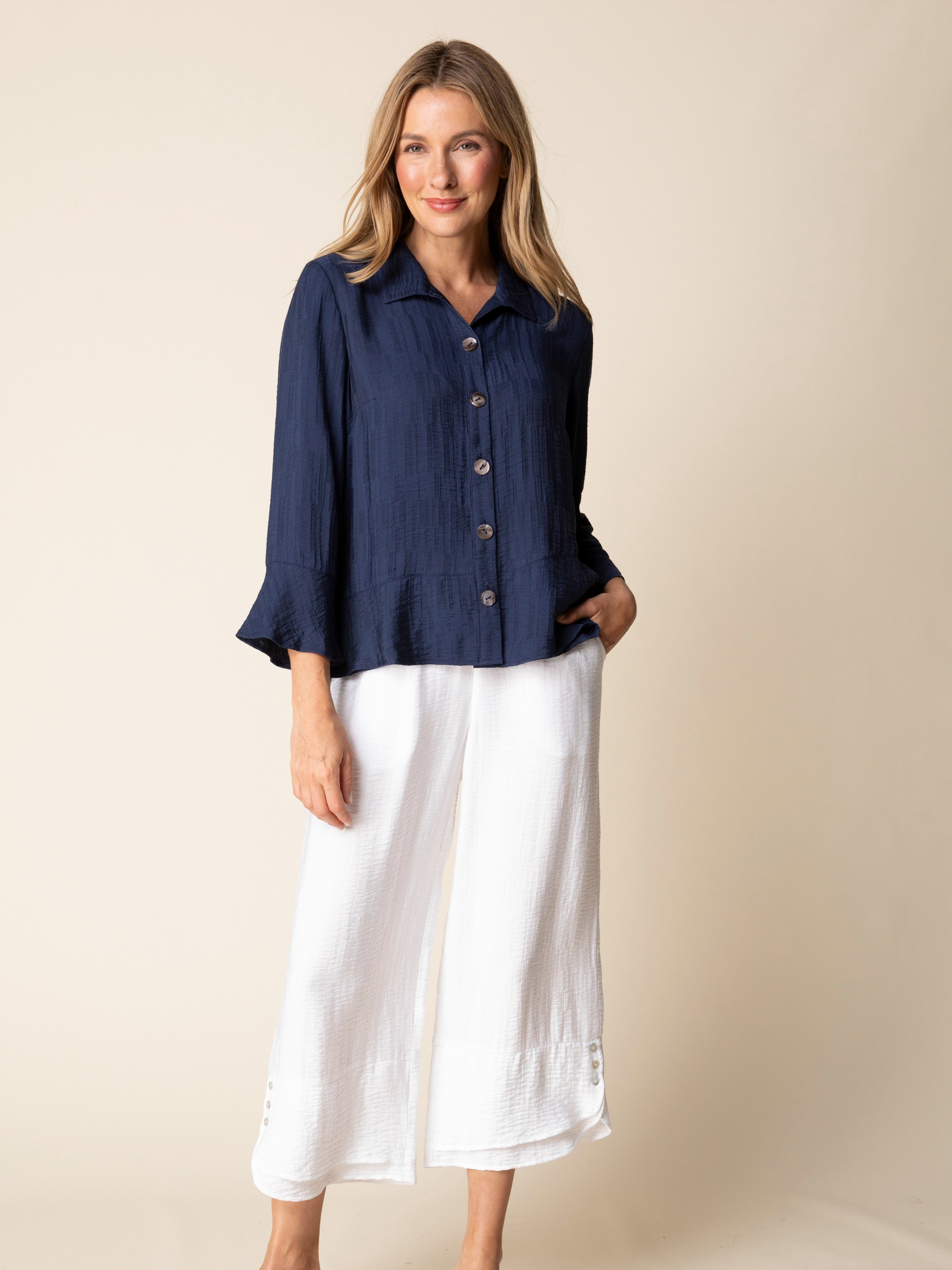 Habitat Flounce Button-Front Soft Jacquard Shirt in navy blue styled with white wide-leg pants, elegant textured soft top.