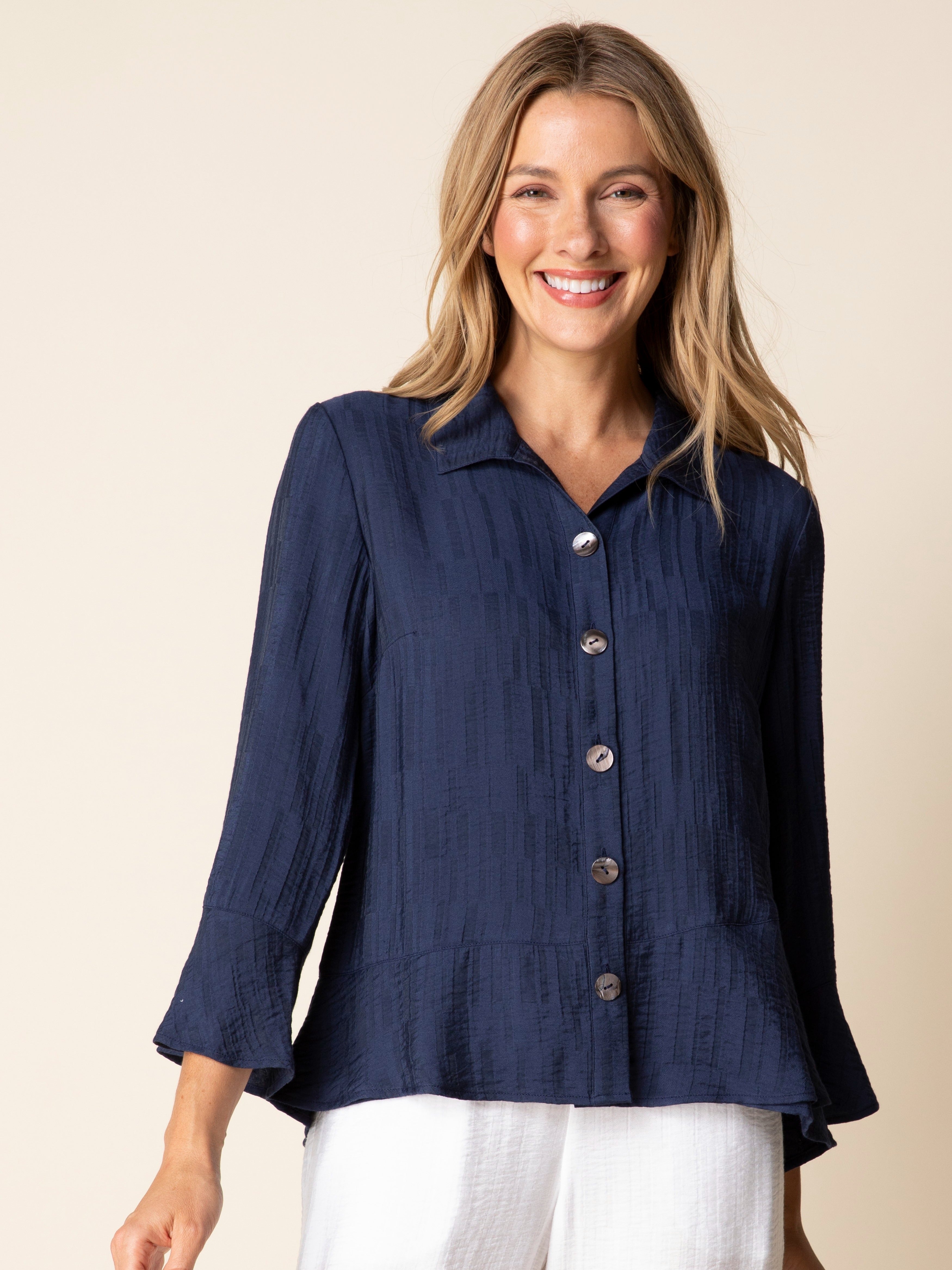 Habitat Flounce Button-Front Soft Jacquard Shirt in navy with long sleeves and silver buttons, styled with white pants.