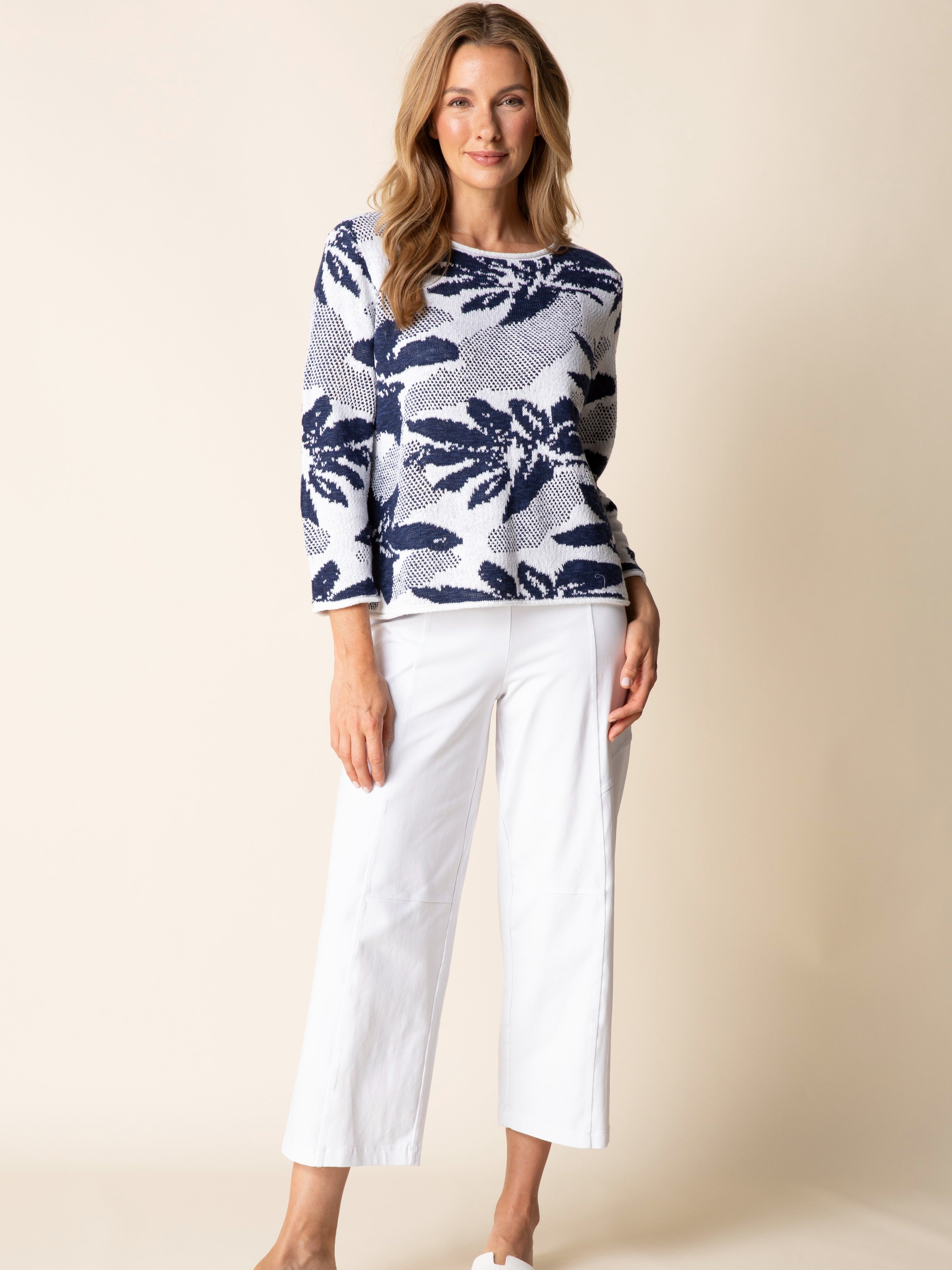 Habitat Sunflower Stitch Cotton Blend Crewneck Sweater in navy floral pattern, styled with white wide-leg pants