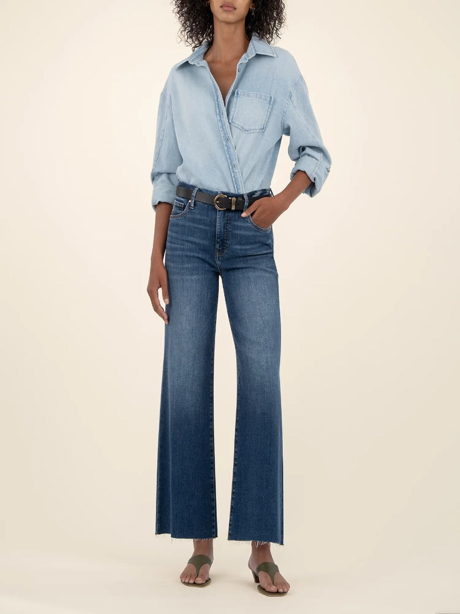 Kut from the Kloth Meg 27” High Rise Wide Jeans in dark denim paired with a light chambray shirt and belt