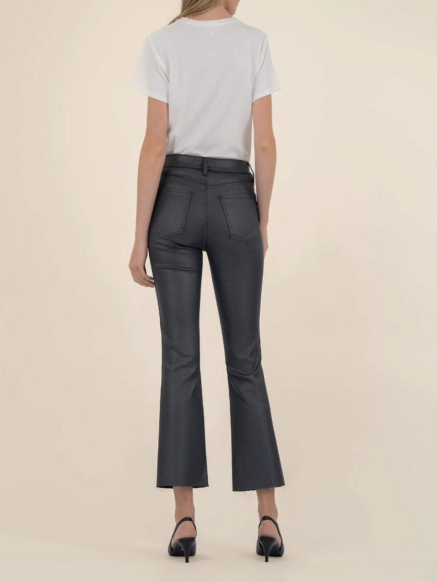 Rear view of black Kut from the Kloth Kelsey Shimmer Flare Jeans styled with a white top and black heels