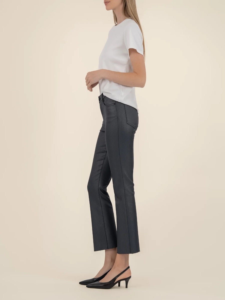 Slim fit black denim Kut from the Kloth Kelsey Shimmer Flare Jeans styled with a white top and black heels.