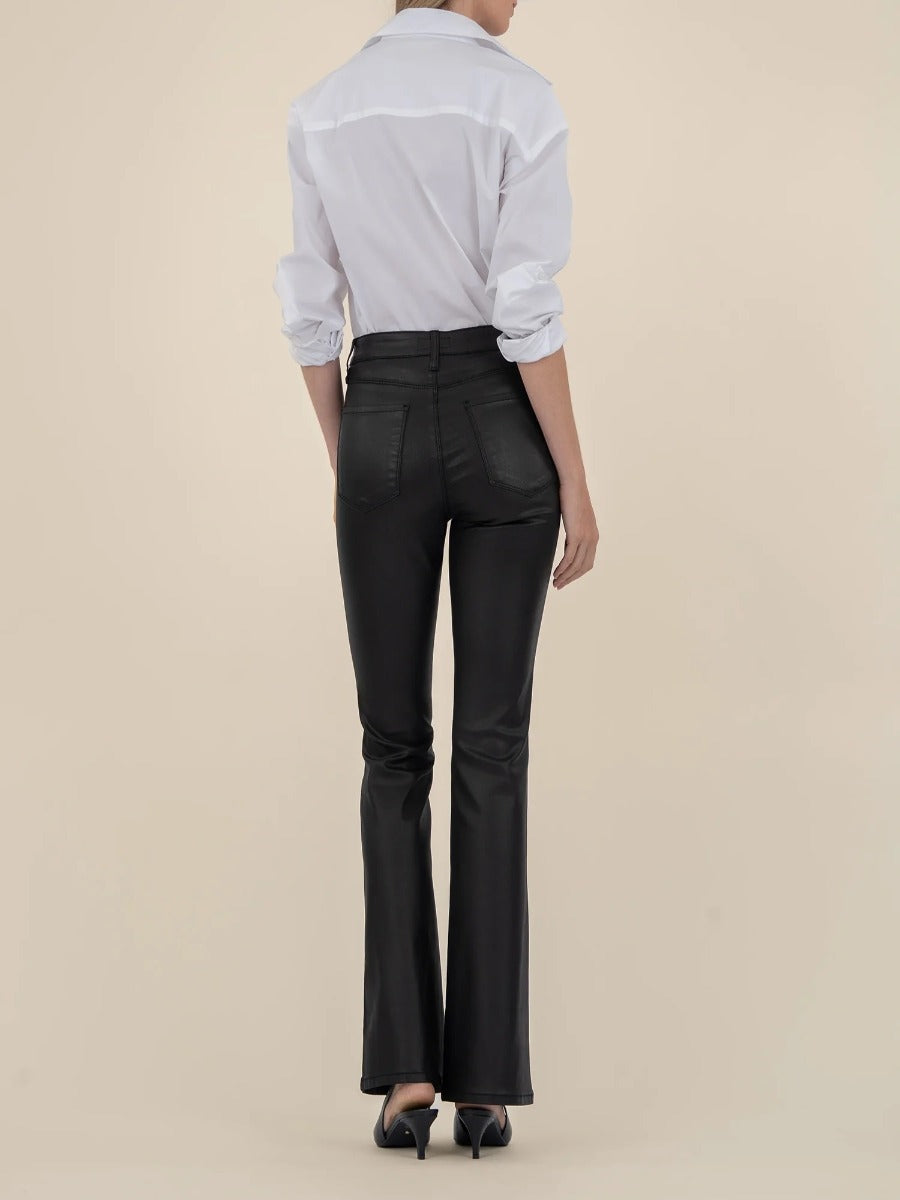 Back view of black Kut from the Kloth Ana 33” Flare Jeans styled with a white shirt and heels.