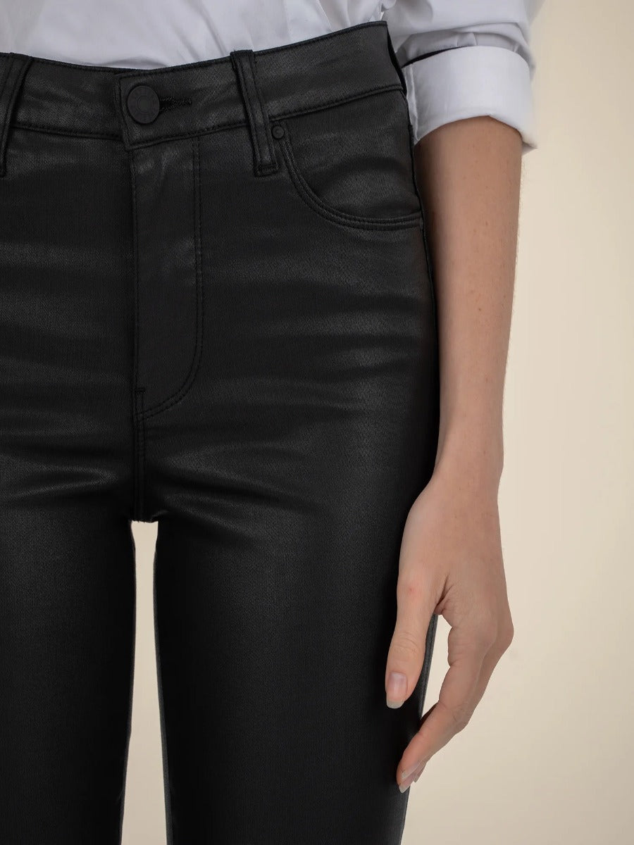 Kut from the Kloth Ana 33” Flare Jeans in black faux leather denim styled with a white cuffed sleeve top