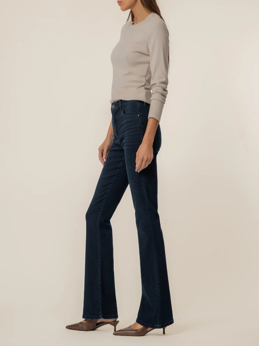 Dark indigo denim flare jeans styled with a beige sweater and brown heels, Kut from the Kloth Ana 33” Flare Denim Jeans.