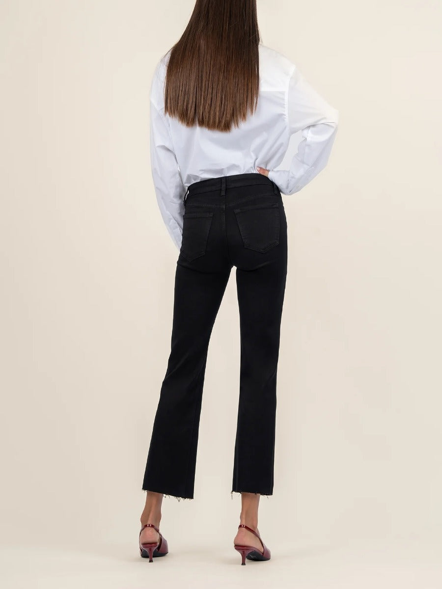 Back view of black denim Kut from the Kloth Kelsey Mid Rise Flare Jeans with raw hem detail