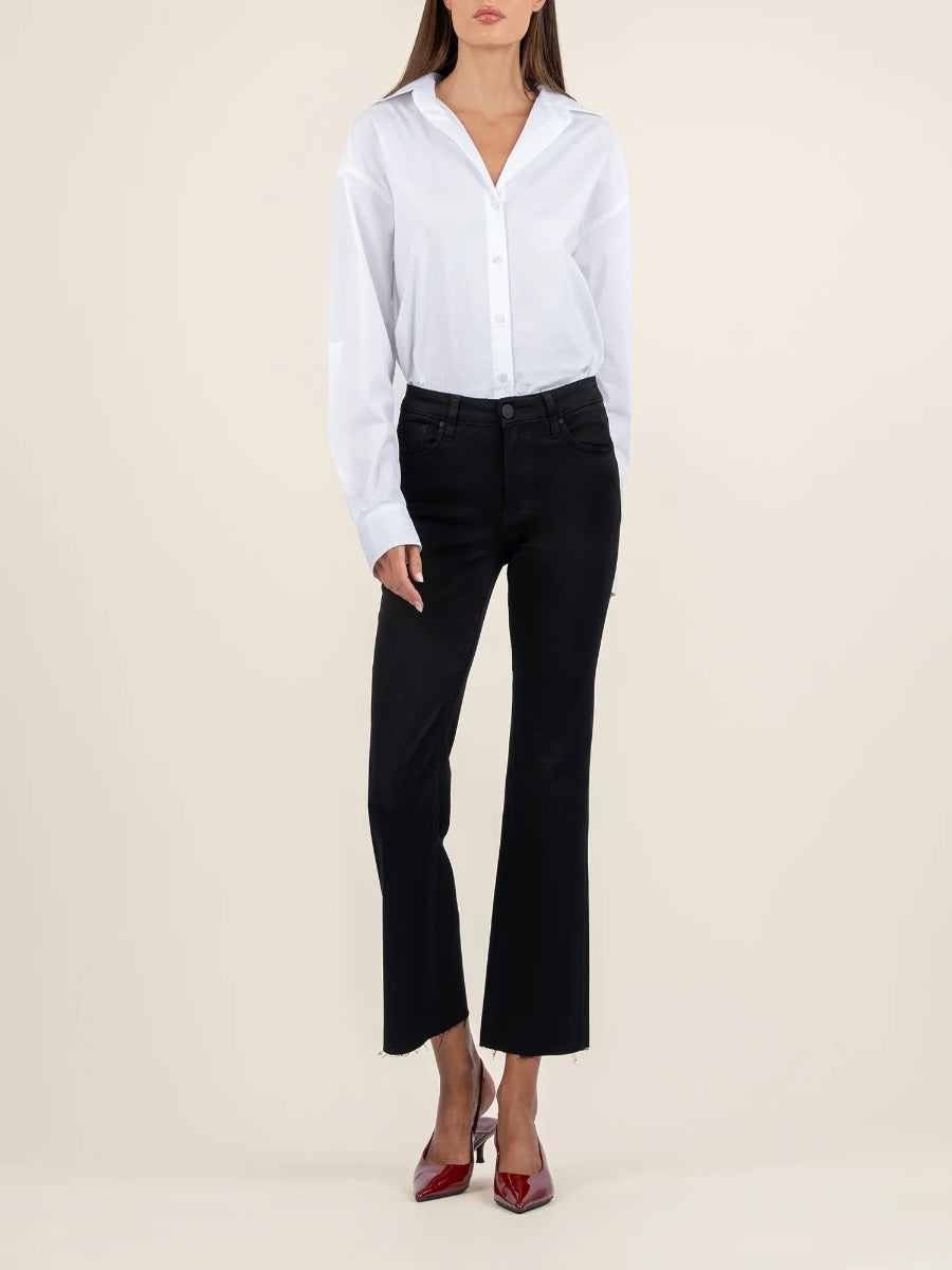 Slim fit black denim Kut from the Kloth Kelsey Mid Rise Flare Jeans styled with a white shirt and red heels