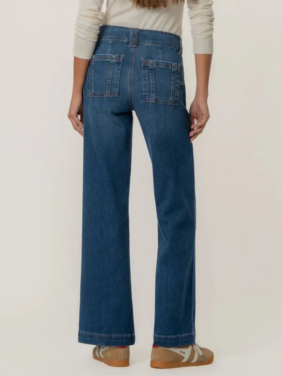 Back view of Kut from the Kloth Jodi 32” Wide Jeans in classic blue denim, paired with casual sneakers.