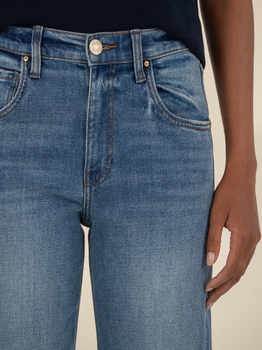 Close-up of blue denim Kut from the Kloth Kit High Rise Straight Leg Jeans with subtle fading and stitched pockets