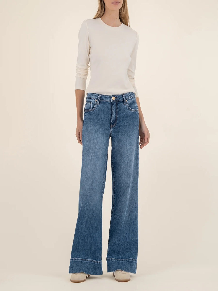 Kut from the Kloth Maya High Rise 31” Wide Leg Trousers in medium blue denim styled with cream sweater
