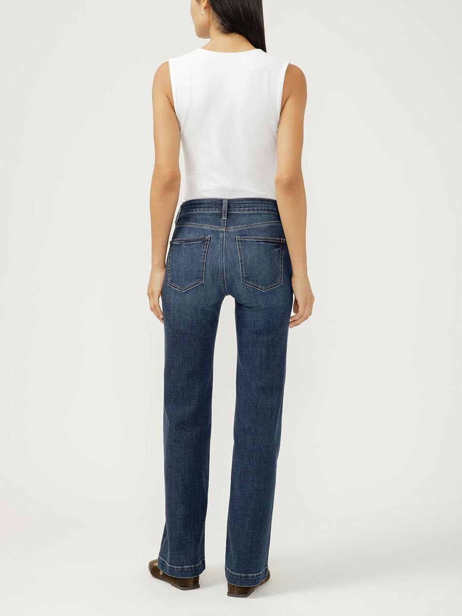 Back view of a model wearing Silver Avery 10.25" Curvy 31" Trouser in indigo denim by Silver.