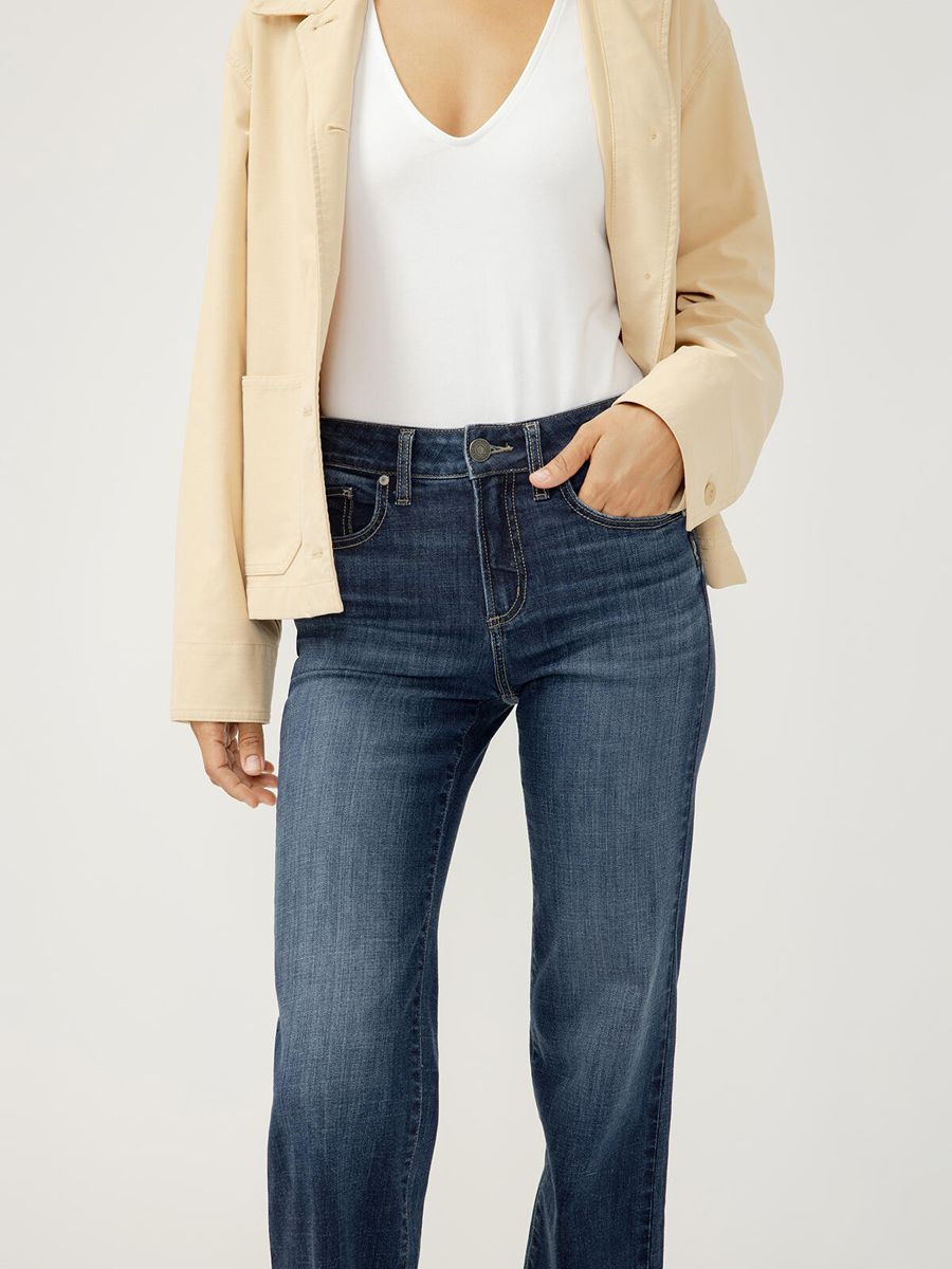 Silver Avery 10.25" Curvy 31" Trouser in indigo denim styled with beige jacket and white top by Silver