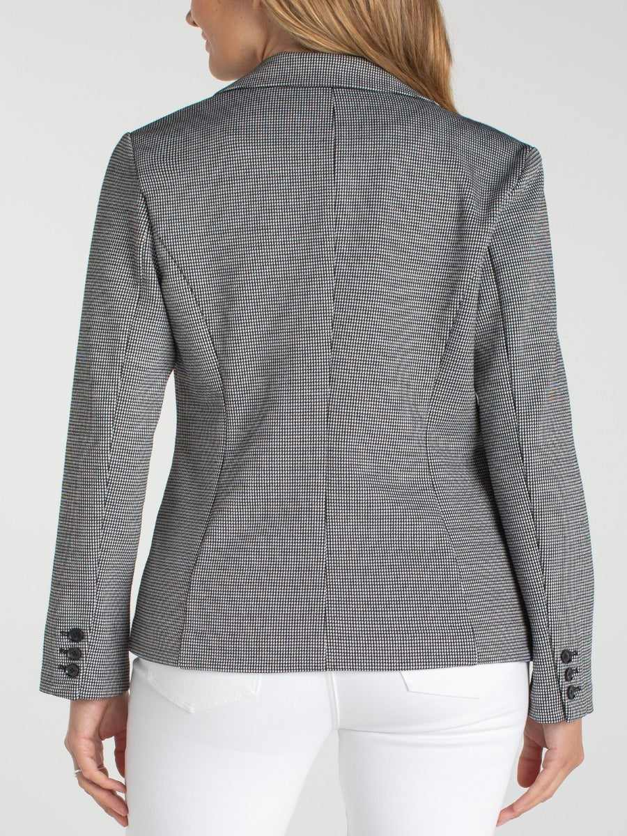 Back view of Liverpool Mini Black & White Fitted Blazer styled with white pants, showcasing tailored outerwear details.