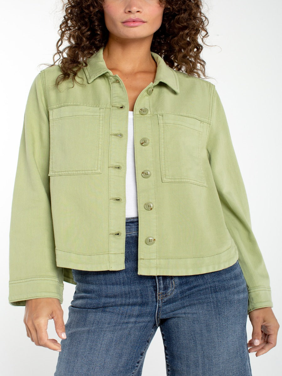 Liverpool Jana Button Front Short Blazer in light green denim with front pockets, styled with blue jeans by Liverpool.