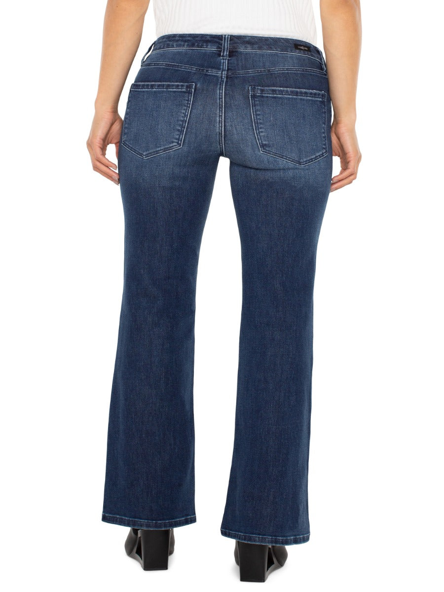 Back view of Liverpool Lucy 32” Bootcut Denim Jeans in dark wash by Liverpool, styled with black shoes.
