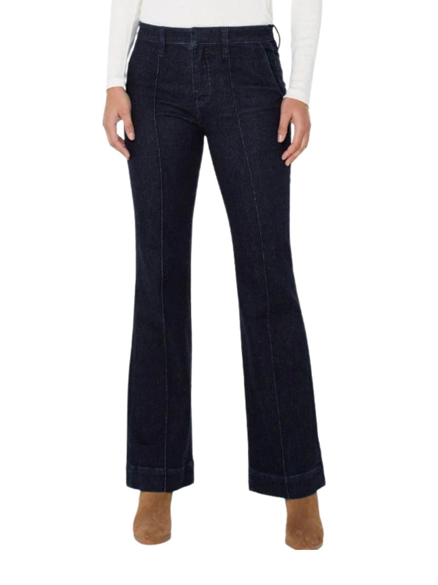 Liverpool Avalon Dark Front Seam 32” Trouser in dark denim by Liverpool, styled with a white top and brown boots.