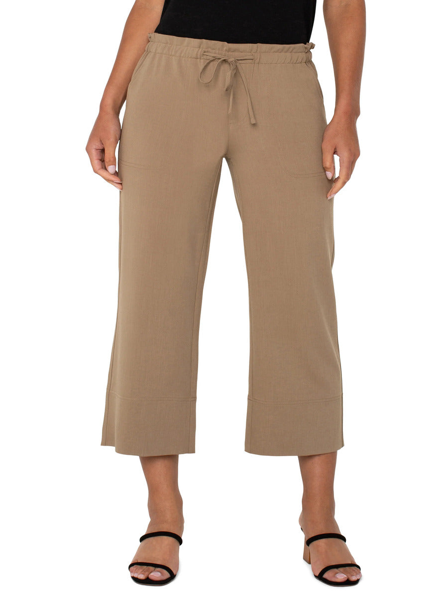 Beige Liverpool Tie Waist Wide Leg 26” Pant styled with a black top and black strappy heels by Liverpool